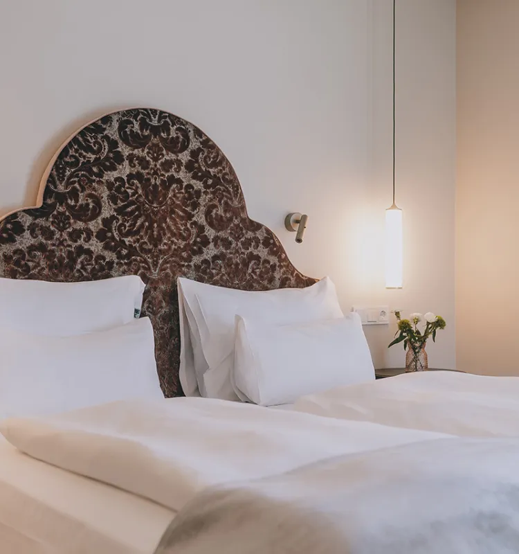 Gemütliches Bett im Superior Zimmer des Wellnesshotels Bad Ischl